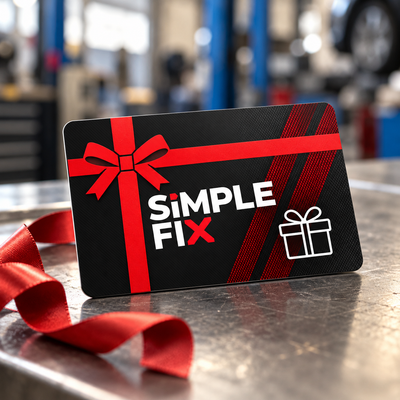 SimpleFix gift card on a workshop bench with red ribbon
